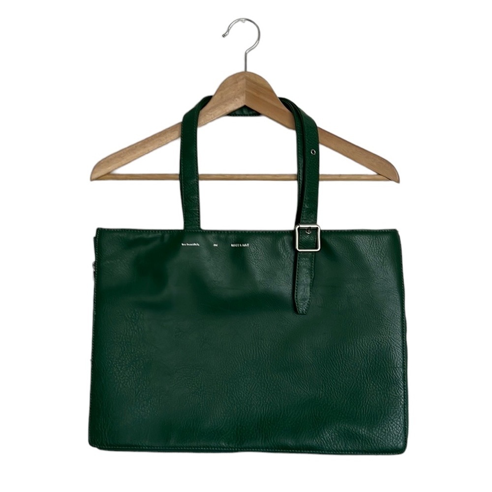 Vegan Tote with magnetic snap closure. It can fit a 16” laptop.